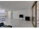 Open living room with tiled floors and a pass-through to the kitchen at 205 E Harmon Ave # 112, Las Vegas, NV 89169