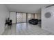 A tiled living room with decorative privacy sliders and seating at 205 E Harmon Ave # 112, Las Vegas, NV 89169