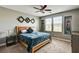 Comfortable bedroom with a ceiling fan, natural light and contemporary decor at 2159 Morro Vista Dr, Las Vegas, NV 89135