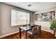 Bright dining room with modern table, contemporary art, and hardwood floors at 2159 Morro Vista Dr, Las Vegas, NV 89135
