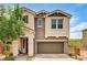 Inviting two-story home with a two-car garage and a charming front porch at 2159 Morro Vista Dr, Las Vegas, NV 89135