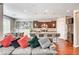 Open floor plan featuring a kitchen island with barstool seating, dining area and comfortable living room at 2159 Morro Vista Dr, Las Vegas, NV 89135