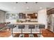 Kitchen island featuring barstool seating, stainless steel appliances, and a tiled backsplash at 2159 Morro Vista Dr, Las Vegas, NV 89135