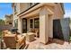 Inviting covered patio with cozy seating area, perfect for outdoor enjoyment with brick pavers at 2159 Morro Vista Dr, Las Vegas, NV 89135