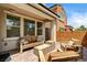 Relaxing covered patio with comfortable seating and stylish decor with brick pavers at 2159 Morro Vista Dr, Las Vegas, NV 89135