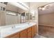 Bathroom vanity with double sinks, spacious mirrors and shower with natural light and ample space at 2319 Little Italy Ave, North Las Vegas, NV 89031