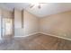 Bedroom with neutral carpeting, high ceilings, and an en-suite bathroom at 2319 Little Italy Ave, North Las Vegas, NV 89031