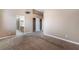 Primary bedroom featuring neutral carpeting, high ceilings, and a large walk-in closet at 2319 Little Italy Ave, North Las Vegas, NV 89031