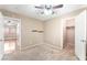 Well-lit bedroom with ceiling fan, carpet flooring, and closet space, ready for personalization at 2319 Little Italy Ave, North Las Vegas, NV 89031
