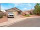 Charming single-story home with desert landscaping and a two car garage at 2319 Little Italy Ave, North Las Vegas, NV 89031