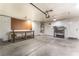 Spacious garage with work bench and storage shelves at 2319 Little Italy Ave, North Las Vegas, NV 89031