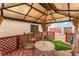 Backyard gazebo with seating, offering a cozy outdoor space at 2319 Little Italy Ave, North Las Vegas, NV 89031