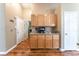 Hallway view of cabinetry and access to the laundry room at 2319 Little Italy Ave, North Las Vegas, NV 89031