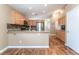 Charming kitchen features granite counters, wood cabinets and stainless steel appliances at 2319 Little Italy Ave, North Las Vegas, NV 89031