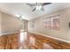Spacious living room with wood floors and natural light from a sliding glass door at 2319 Little Italy Ave, North Las Vegas, NV 89031