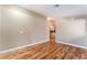 Spacious living room with hardwood floors and view into the kitchen at 2319 Little Italy Ave, North Las Vegas, NV 89031