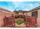 View of the backyard patio featuring seating and a gazebo at 2319 Little Italy Ave, North Las Vegas, NV 89031