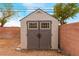 Backyard shed with double doors for extra storage at 2319 Little Italy Ave, North Las Vegas, NV 89031
