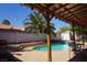 Enjoy the outdoors with a covered patio and a view of the backyard pool at 2874 Tori Way, Henderson, NV 89074