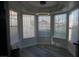 Dining area with modern light fixture and lots of natural light from bay windows at 2874 Tori Way, Henderson, NV 89074