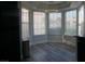 Dining area with modern light fixture and lots of natural light from bay windows at 2874 Tori Way, Henderson, NV 89074