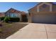 Inviting single-story house features a spacious two-car garage and manicured landscaping at 2874 Tori Way, Henderson, NV 89074