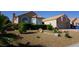 Lovely single-story home boasts a well-kept gravel yard and attached two-car garage at 2874 Tori Way, Henderson, NV 89074