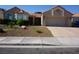 Charming single-story home with a well-maintained front yard and attached two-car garage at 2874 Tori Way, Henderson, NV 89074