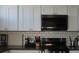 A well-equipped kitchen showcases modern stainless steel appliances and ample counter space at 2874 Tori Way, Henderson, NV 89074