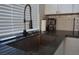 Kitchen features stainless steel sink and faucet, granite countertops, and subway tile backsplash at 2874 Tori Way, Henderson, NV 89074