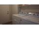 Laundry room features a modern washer and dryer set for convenient laundry care at 2874 Tori Way, Henderson, NV 89074