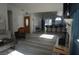 Open concept living room features hardwood floors and flows into kitchen with breakfast bar at 2874 Tori Way, Henderson, NV 89074