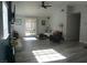 Bright living room with a fireplace, sliding glass doors and views of the backyard pool at 2874 Tori Way, Henderson, NV 89074