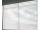 Window with closed blinds to promote a dark room at 2874 Tori Way, Henderson, NV 89074