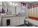 Bathroom with a single vanity, large mirror and shower with curtain at 3708 Fuselier Dr, North Las Vegas, NV 89032