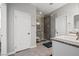 Modern bathroom featuring a glass shower, tiled walls, and contemporary fixtures at 3708 Fuselier Dr, North Las Vegas, NV 89032