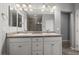 Bathroom with double vanity, granite counters, and ample lighting at 3708 Fuselier Dr, North Las Vegas, NV 89032