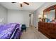 Bedroom with plush carpeting, dresser, and natural lighting creating a warm and inviting atmosphere at 3708 Fuselier Dr, North Las Vegas, NV 89032