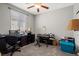 Bedroom with ceiling fan, window and desk area; a functional space at 3708 Fuselier Dr, North Las Vegas, NV 89032