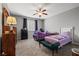 Comfortable bedroom with a ceiling fan, two twin beds with stylish bedding and ample natural light at 3708 Fuselier Dr, North Las Vegas, NV 89032