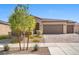 Beautiful single-story home featuring desert landscaping and a three-car garage at 3708 Fuselier Dr, North Las Vegas, NV 89032