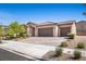 Charming single-story home with desert landscaping, three-car garage, and tile roof at 3708 Fuselier Dr, North Las Vegas, NV 89032