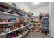 Well-stocked walk-in pantry with ample shelving for organized storage of groceries and household items at 3708 Fuselier Dr, North Las Vegas, NV 89032