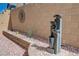 Charming backyard featuring a decorative water fountain and desert landscaping at 387 Larksong Ave, Henderson, NV 89011