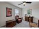 Cozy bedroom with natural light, plush chair, and decorative accents at 387 Larksong Ave, Henderson, NV 89011