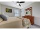 Inviting bedroom with dresser and window letting in natural light at 387 Larksong Ave, Henderson, NV 89011