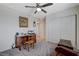 Neutral bedroom featuring a ceiling fan, closet, and vintage desk at 387 Larksong Ave, Henderson, NV 89011