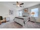 Tranquil bedroom with natural light and neutral-toned furnishings at 387 Larksong Ave, Henderson, NV 89011