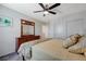 Comfortable bedroom with a ceiling fan, closet, dresser, and natural light at 387 Larksong Ave, Henderson, NV 89011