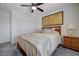 Comfortable bedroom with a ceiling fan, sliding door closet, and natural light at 387 Larksong Ave, Henderson, NV 89011